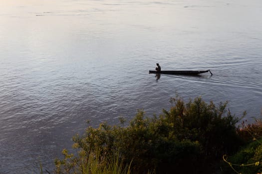 Sunset on Mekong river with fisherman, Laos