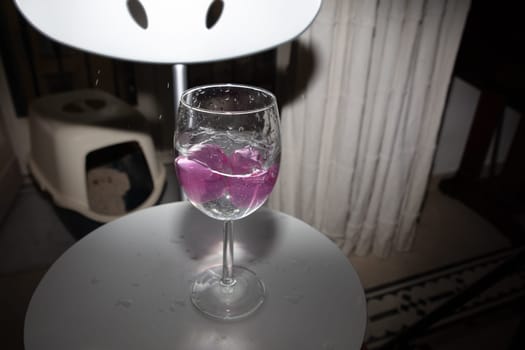 empty glass with ice cubes on white background