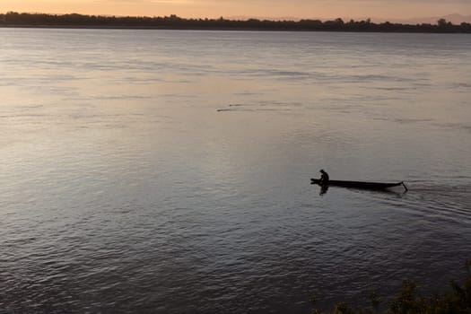 Sunset on Mekong river with fisherman, Laos