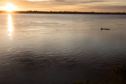 Sunset on Mekong river with fisherman, Laos