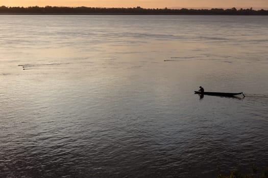 Sunset on Mekong river with fisherman, Laos