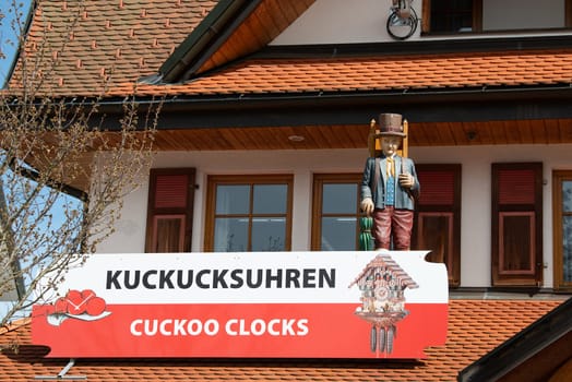 Cuckoo clocks in a shop in the Black Forest, Lake Titisee Neustadt in Germany, traditional craft, vintage wood carving