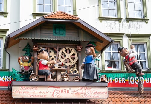 Cuckoo clock with bears at a shop in the Black Forest, Triberg in Germany, traditional craft, vintage wood carving, 30.03.2024