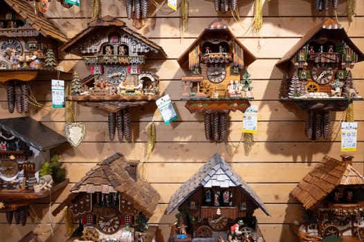 Cuckoo clocks in a shop in the Black Forest, Lake Titisee Neustadt in Germany, traditional craft, vintage wood carving, 30.03.2024