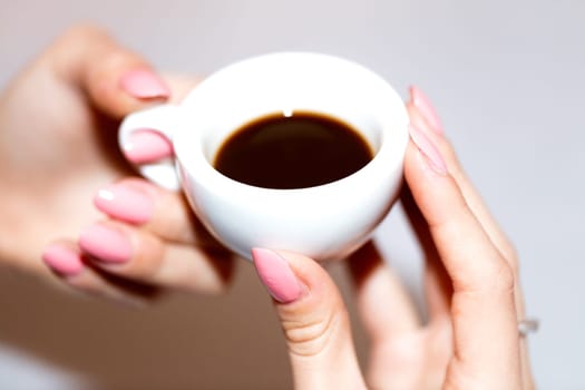 Taking the neapolitan coffee in ceramic cup