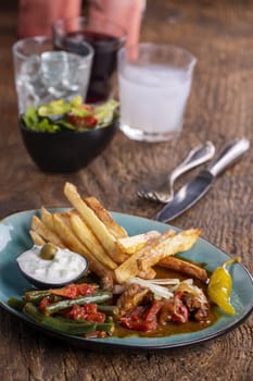 greek gyros with metaxa sauce and fries