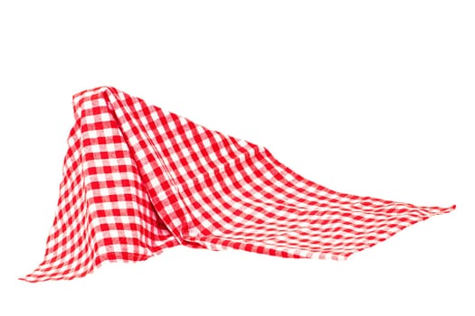 Closeup of a red and white checkered napkin or tablecloth texture isolated on white background. Kitchen accessories. Top view.