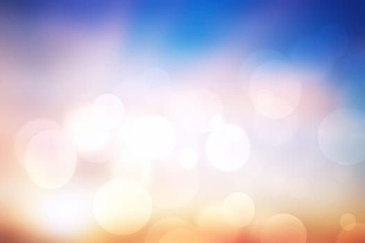 Abstract bright gradient motion spring or summer landscape texture background with natural gold yellow bokeh lights and blue bright sunny sky. Beautiful backdrop with space for design.