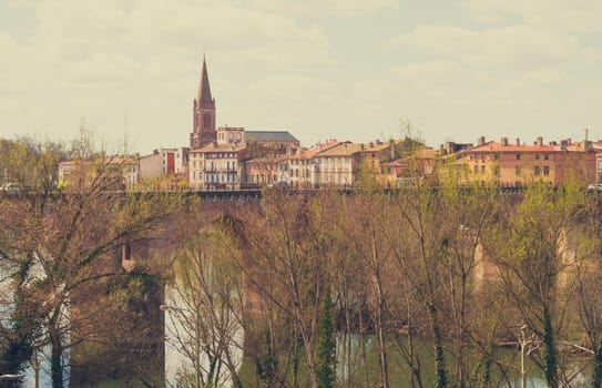 Montauban, France - 03 25 2023 :Overview of the Lot river with old bridge and town, Montauban, Lot, Occitanie, France