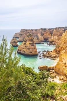 Cliffs and ocean, vertical photography of Praia da Marinha near Benagil, Algarve, Portugal