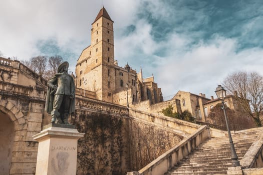 Auch, France - Mars 12 2023: Monumental staircase, statue of d Artagnan and Armagnac Tower, Auch, France