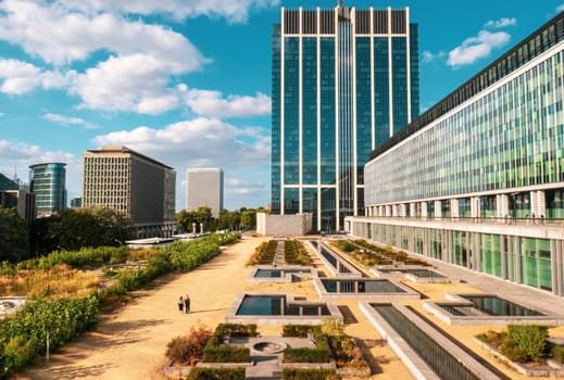 Brussels, Belgium - August 20 2022: Modern glass buildings and botanical garden in Brussels city