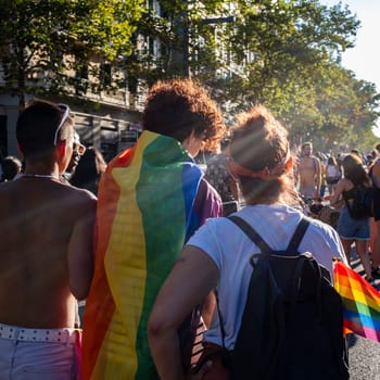 Rear view of LGBT collective sympathizers parading wearing the colors of the rainbow flag. The motto of the Pride 2023 edition was "The Pride of Our Lives,"" with the intention of honoring previous generations who paved the way for members of the collective."