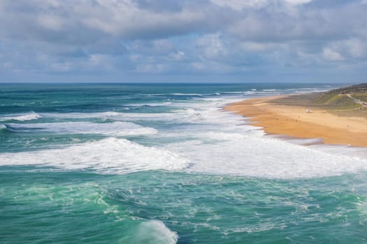 Nazaré 's North beach, Praia do Norte, Nazaré. World record of biggest wave. Beach with rough sea.
