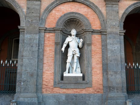 Alfonso D'Aragona statue on facade of the Palazzo Reale. Napoli, Italy