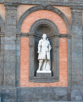 Alfonso D'Aragona statue on facade of the Palazzo Reale. Napoli, Italy