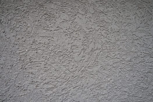 Plaster background pattern. Plaster is a building material used for the protective or decorative coating of walls and ceilings and for moulding and casting decorative elements. Building facade.