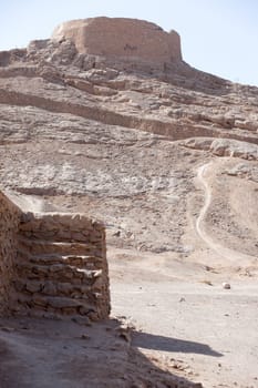 tower of silence , Yazd, Zoroastrian tradition considered a dead body to be nasu, unclean. To preclude the pollution of earth or fire  the bodies of the dead are placed a top a dakhma and so exposed to the sun and to scavenging bird