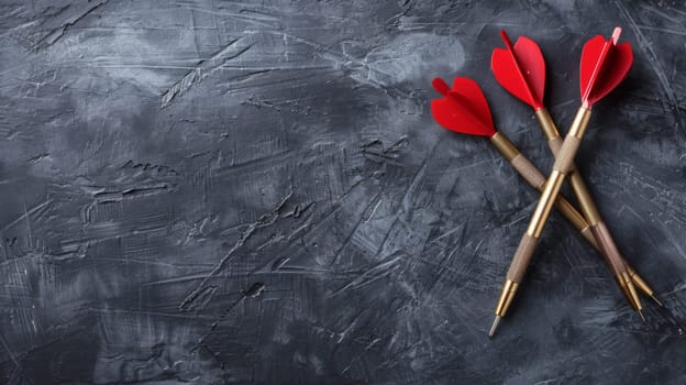 Two vibrant red flowers are placed on top of a sleek black table, creating a striking contrast in color and texture.