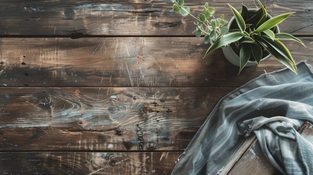 A potted plant is placed on top of a wooden table, the green leaves contrasting with the brown table surface. The plant appears healthy and well cared for, adding a touch of nature to the indoor space.