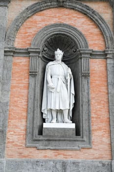 Alfonso D'Aragona statue on facade of the Palazzo Reale. Napoli, Italy