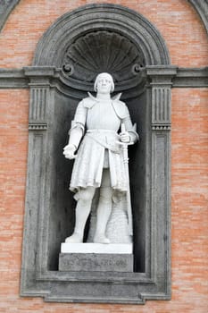 Alfonso D'Aragona statue on facade of the Palazzo Reale. Napoli, Italy