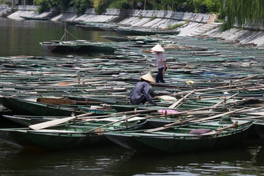 Boating on  the Mekong Delta with concal hats, Vietnam