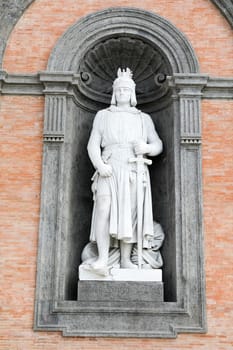 Federico II di Svevia statue on facade of the Palazzo Reale. Napoli, Italy
