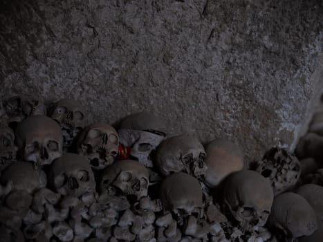 Skull and bones in ancient ossuary, Naples