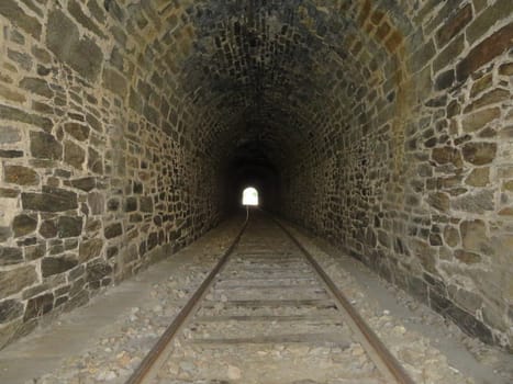 iron road bridges metal rail light at the end of the tunnel train transport