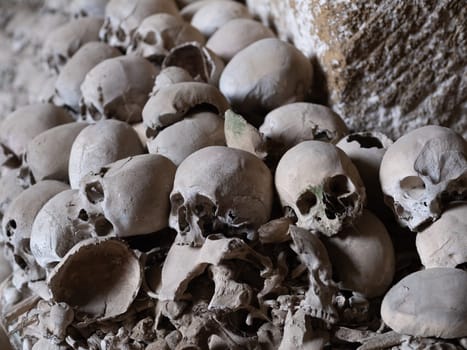 Skull and bones in ancient ossuary, Naples