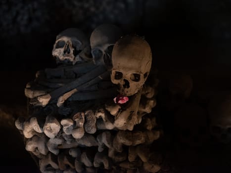 Skull and bones in ancient ossuary, Naples