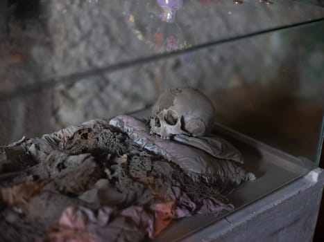 Skull and bones in ancient ossuary, Naples