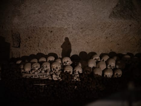 Skull and bones in ancient ossuary, Naples