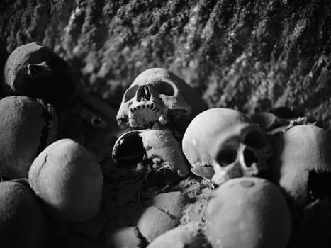 Skull and bones in ancient ossuary, Naples