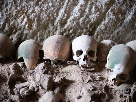 Skull and bones in ancient ossuary, Naples