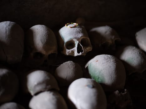 Skull and bones in ancient ossuary, Naples