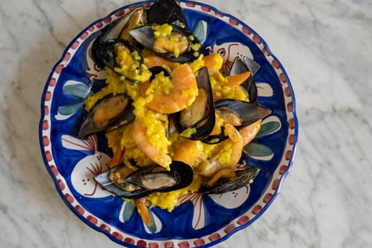 Rice with  mussel safran mix on the plate