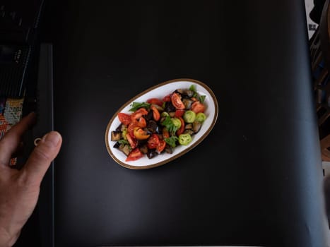 caponata, italian sicilian eggplant  vegetable stew on black backround