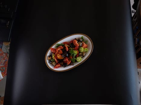 caponata, italian sicilian eggplant  vegetable stew on black backround