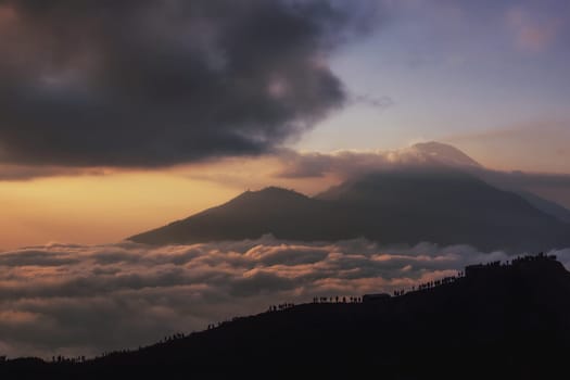 Scenic view of clouds and mist at sunrise from the top of mount Batur (Kintamani volcano), Bali, Indonesia