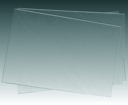 Abstract monochrome background with blank sheets of paper on a gray background