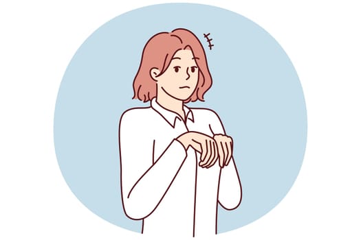 Young girl stands like puppy or bunny, bending palms near chest in pose symbolizing obedience and humility. Attractive woman in white shirt looks at screen in embarrassment