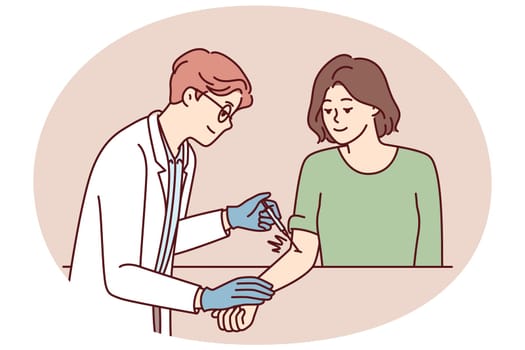 Doctor inoculates girl patient designed to protect against virus and develop immunity. Man clinic employee in white coat puts injection with medical drug into woman hand