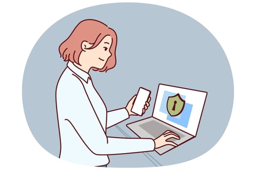 Businesswoman takes care of cyber security standing next to laptop with privacy inscription symbolizing data protection. Girl system administrator uses antivirus or firewall for cyber security