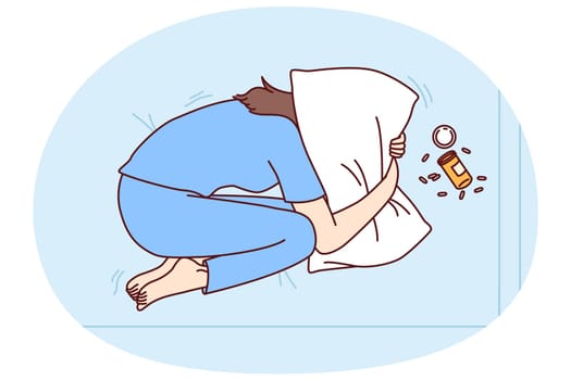 Depressed woman suffering from overdose of antidepressants covers head with pillow in need of qualified doctor help. Concept of overdose from drugs or prescription pills from psychotherapist