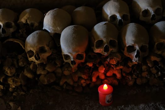 Skull and bones in ancient ossuary, Naples