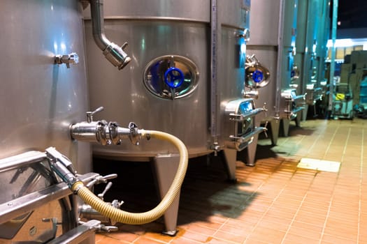 Cellar with an industrial wine production system