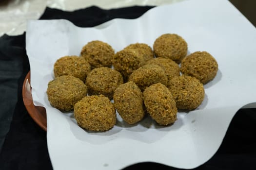 Hummus , sauce made from chickpea paste and sesame seed paste flavored with olive oil, garlic, lemon and paprika juice, cumin seed powder and finely chopped parsley.
