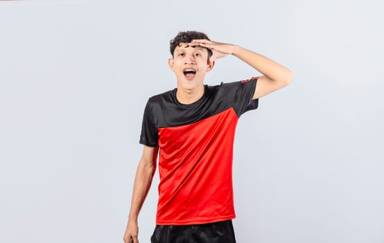Amazed young man with his mouth open with his hand on his forehead, surprised guy with his mouth open with his hand on his forehead, concept of someone astonished